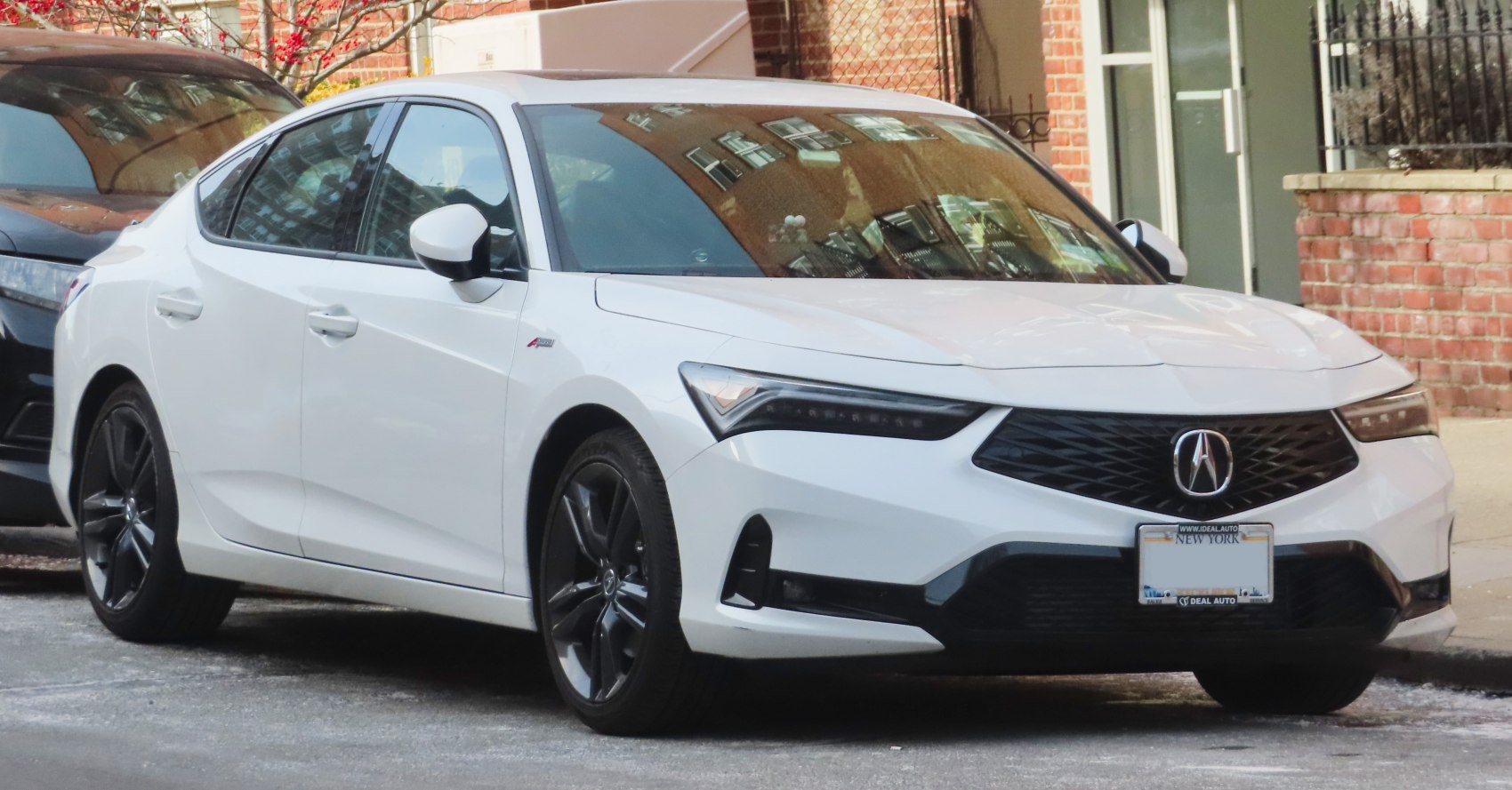 Front 3-quarter view with LED headlights and aerodynamic body