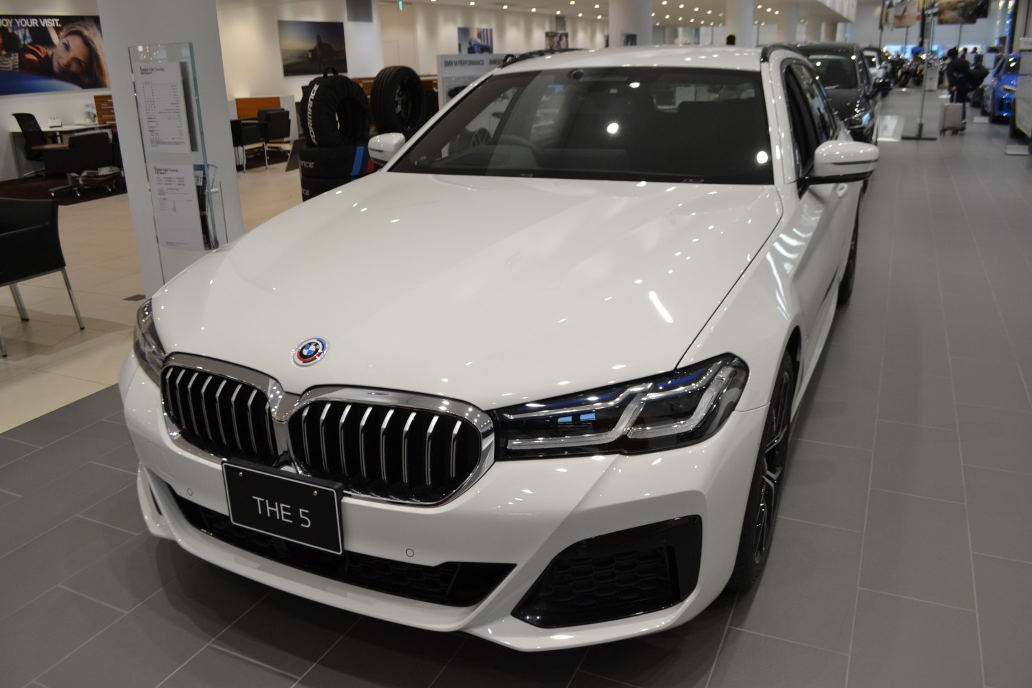 Front kidney grille and LED headlights of a luxury wagon