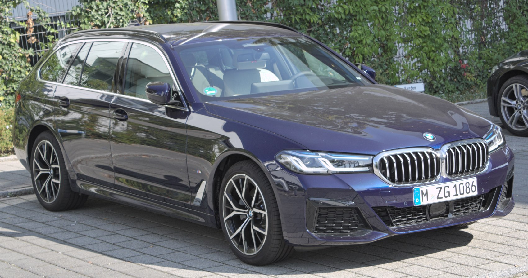 Elegant estate with modern headlights and sporty alloy wheels