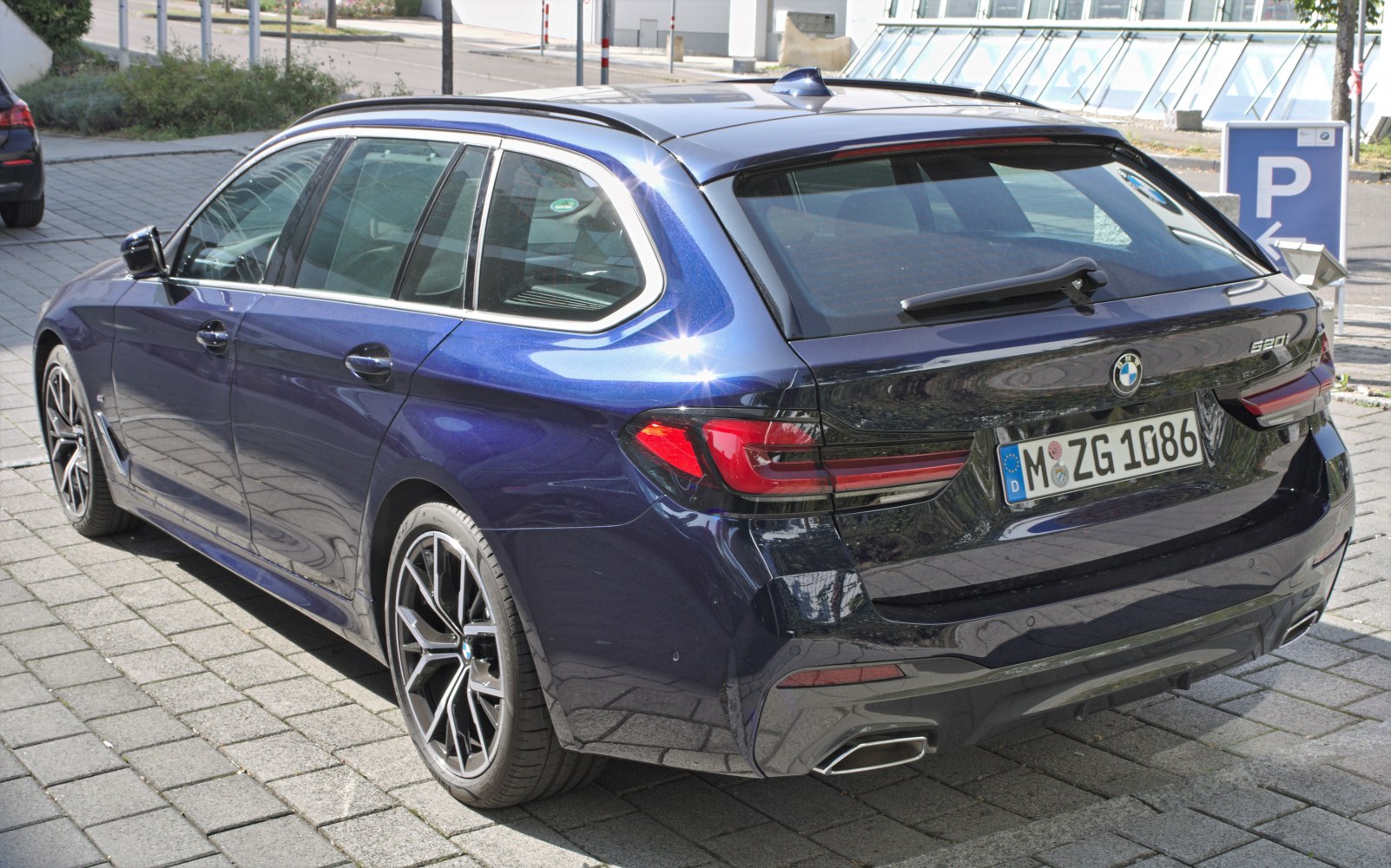 Rear view with alloy wheels and dual exhaust tips