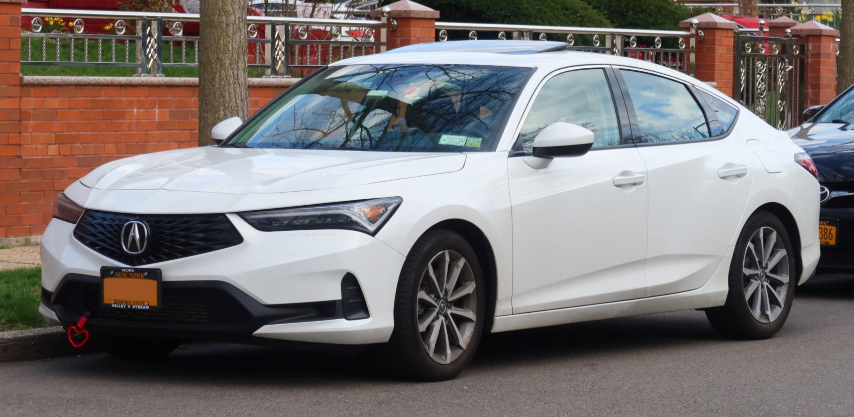 Front grille and alloy wheels of a modern compact sedan