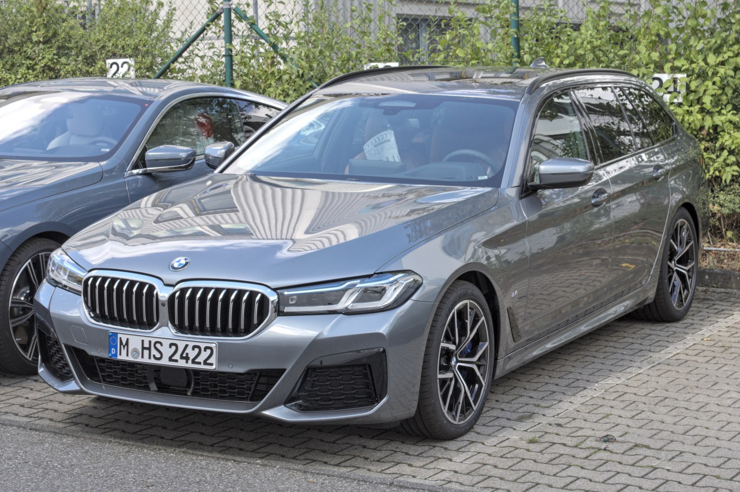 Front and side view of a modern luxury wagon with sporty wheels