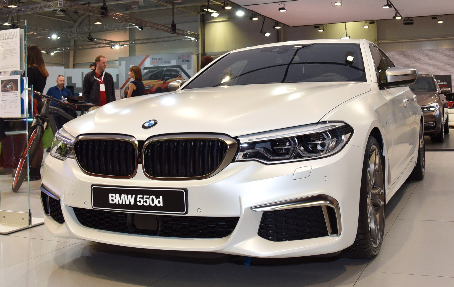 Close-up of BMW kidney grille and LED headlights.