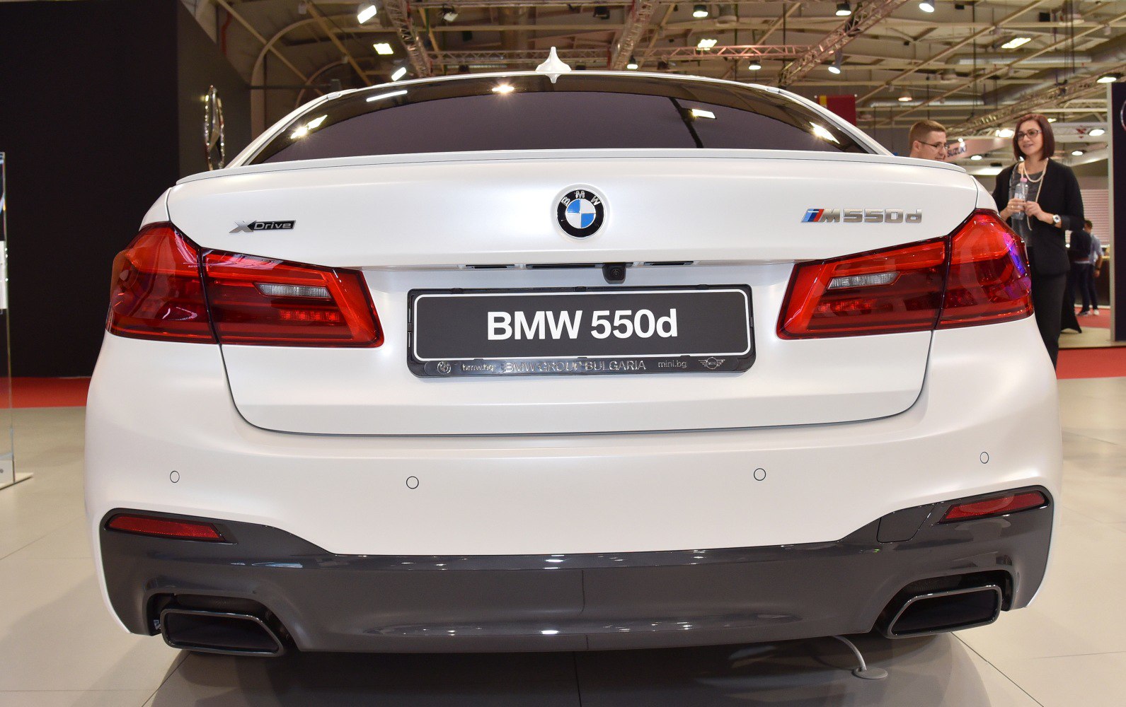 Rear view showing M550d badge, xDrive emblem and dual rectangular exhausts