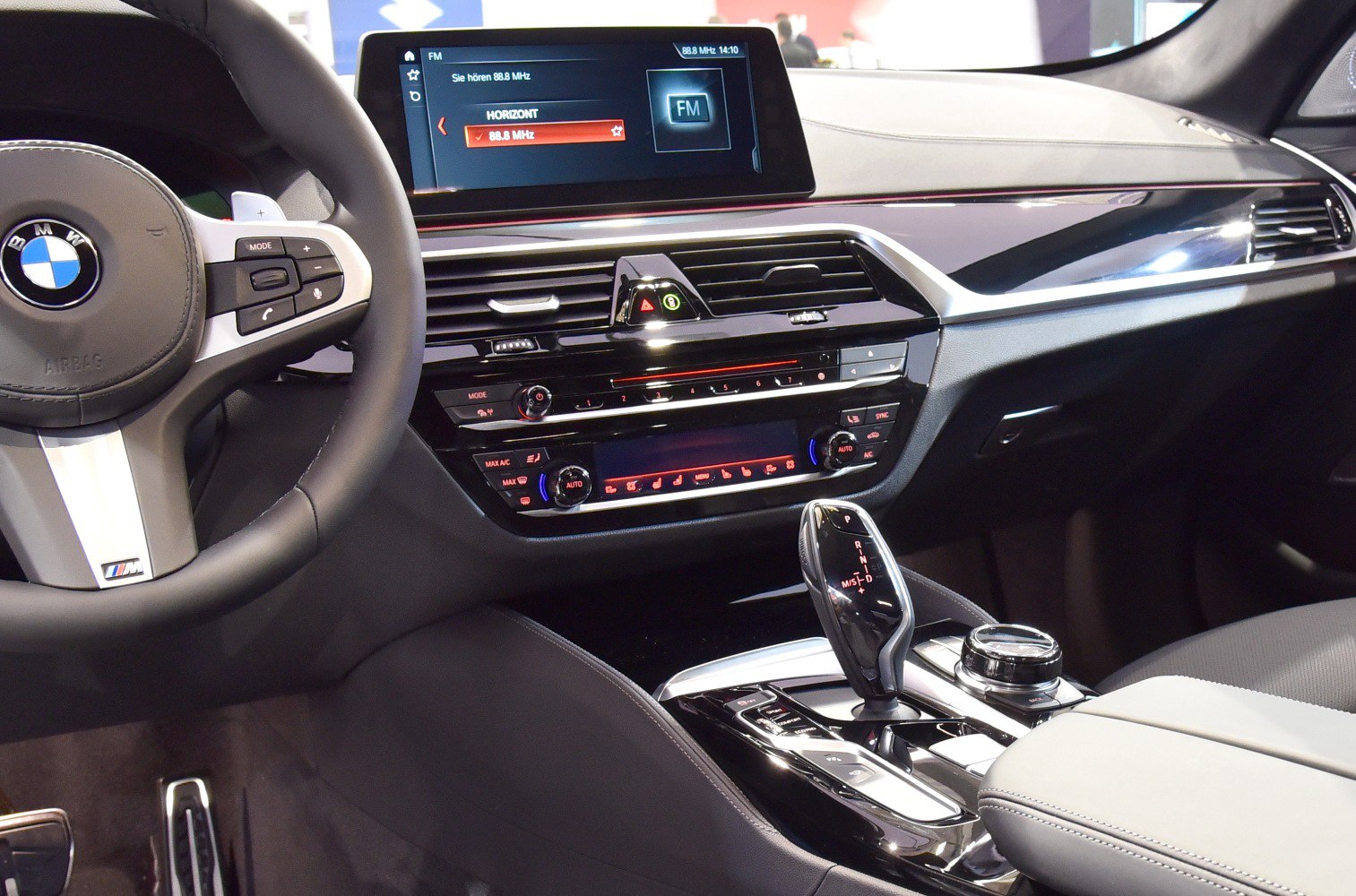 Interior dashboard with infotainment screen and electronic gear shifter