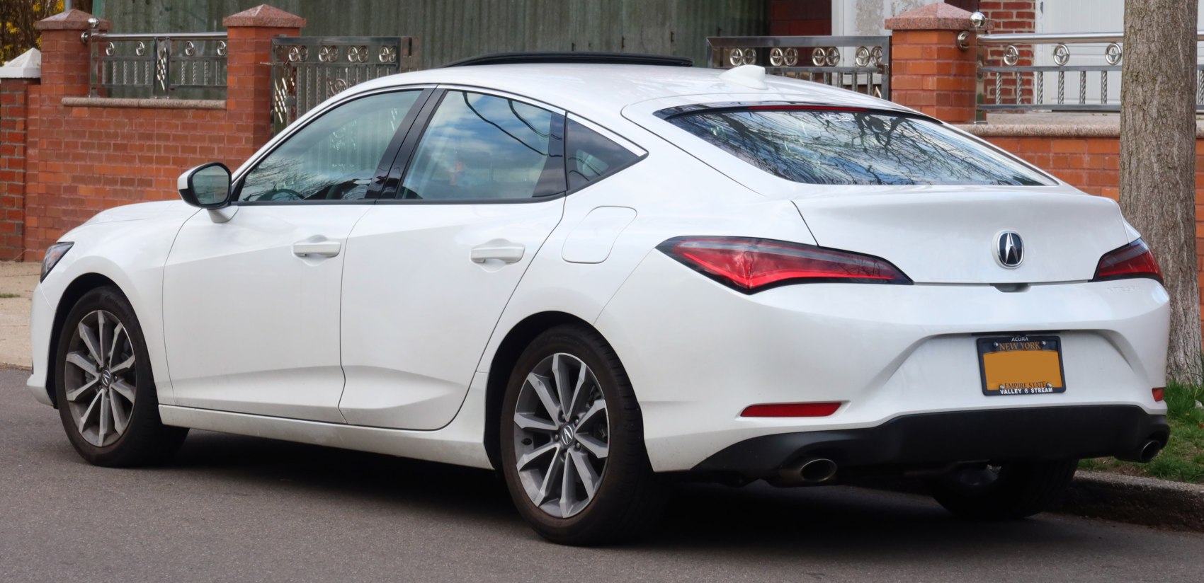 Rear and side view with distinct tail lights and alloy wheels