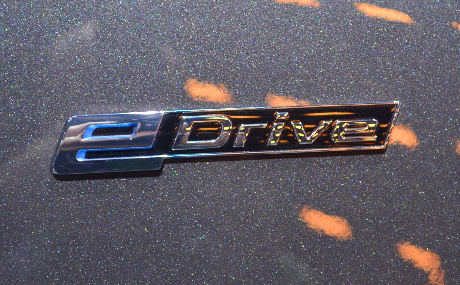 Close-up of eDrive badge emblem on car surface