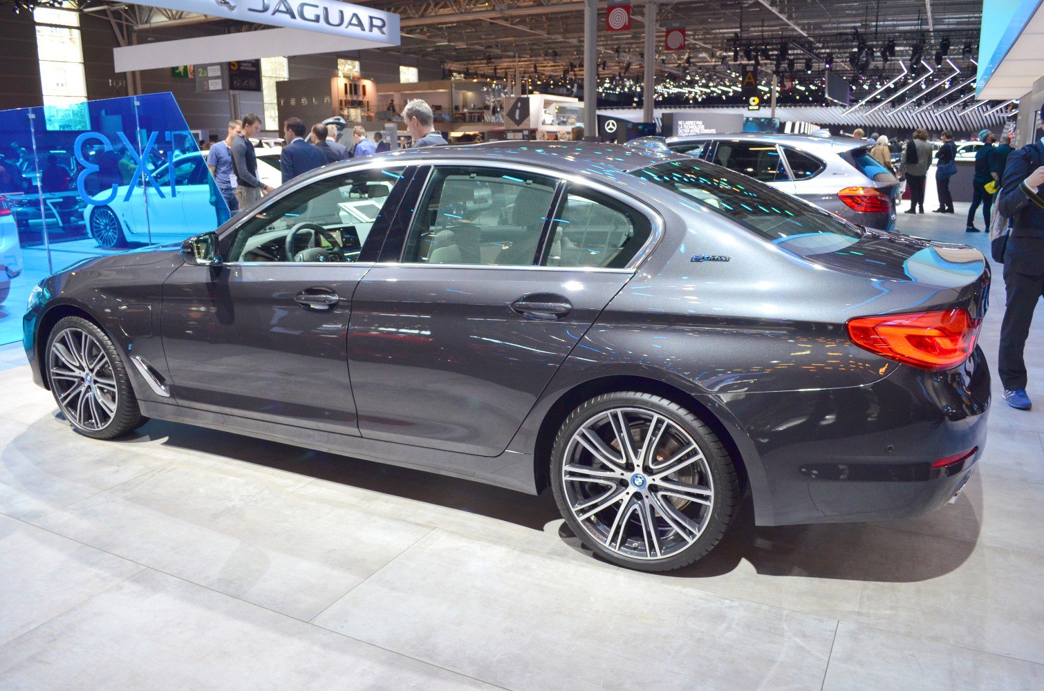 Side profile of a luxury sedan with alloy wheels and sleek design