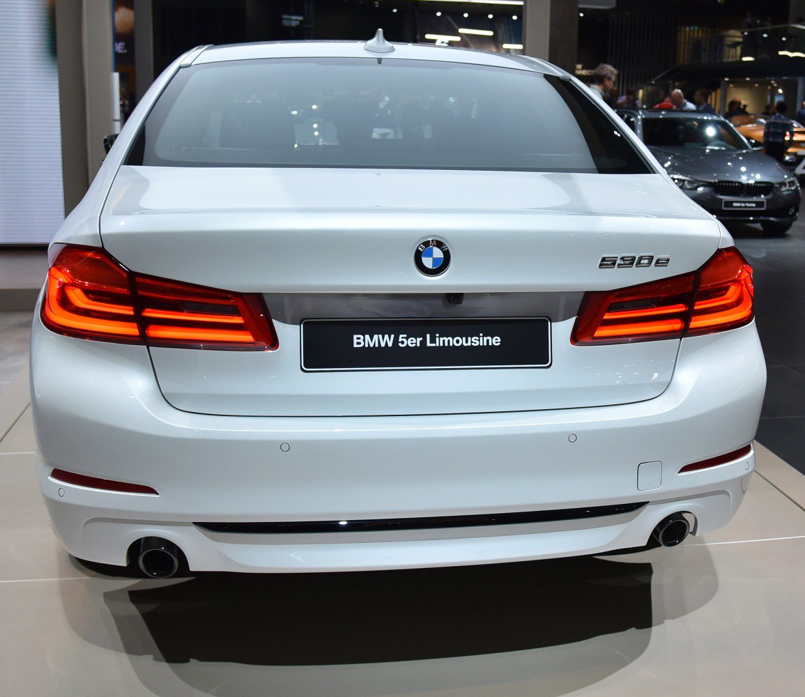 Rear view of a sedan with LED tail lights and dual exhausts
