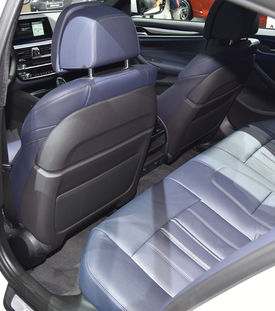 Rear interior showing blue leather seats and spacious legroom