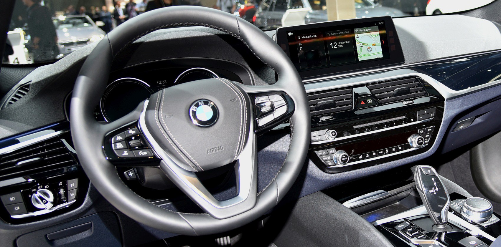 Dashboard, steering wheel, and infotainment system in modern luxury car interior