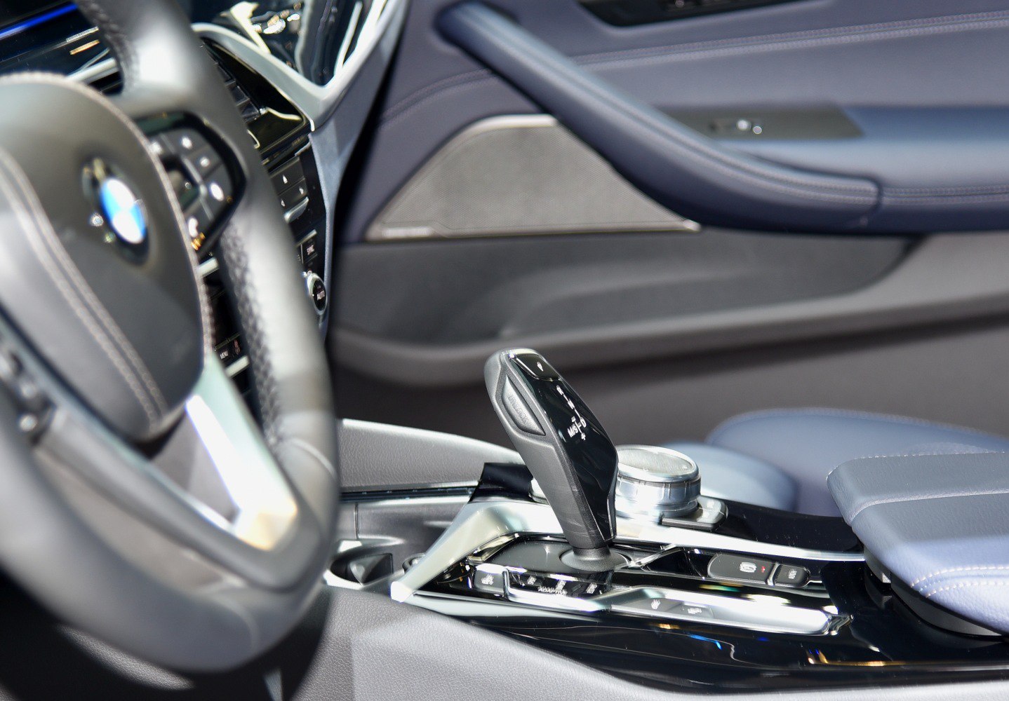 Close-up of gear shifter and control console inside a car interior