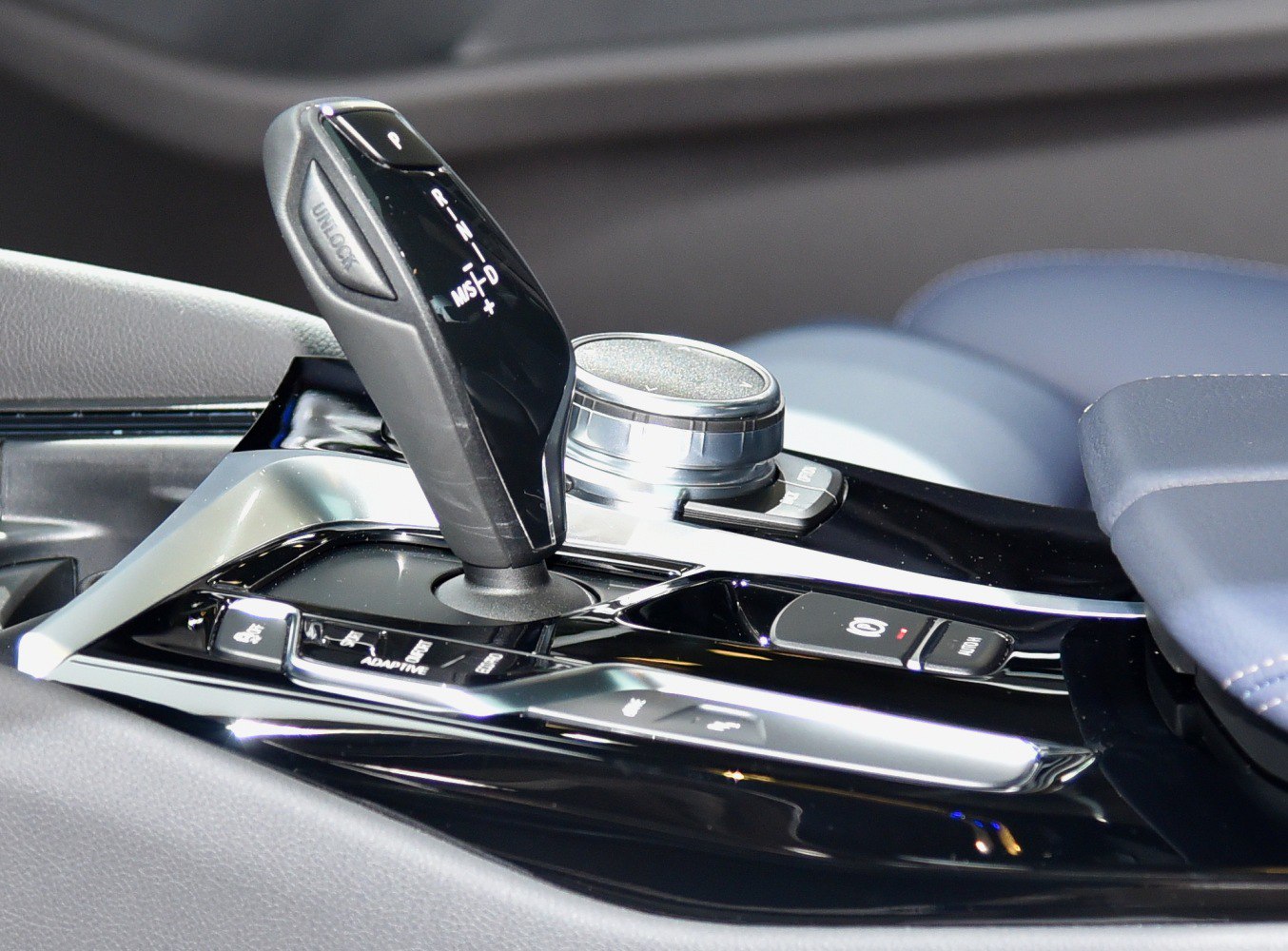 Close-up of gear selector and control knob in car interior