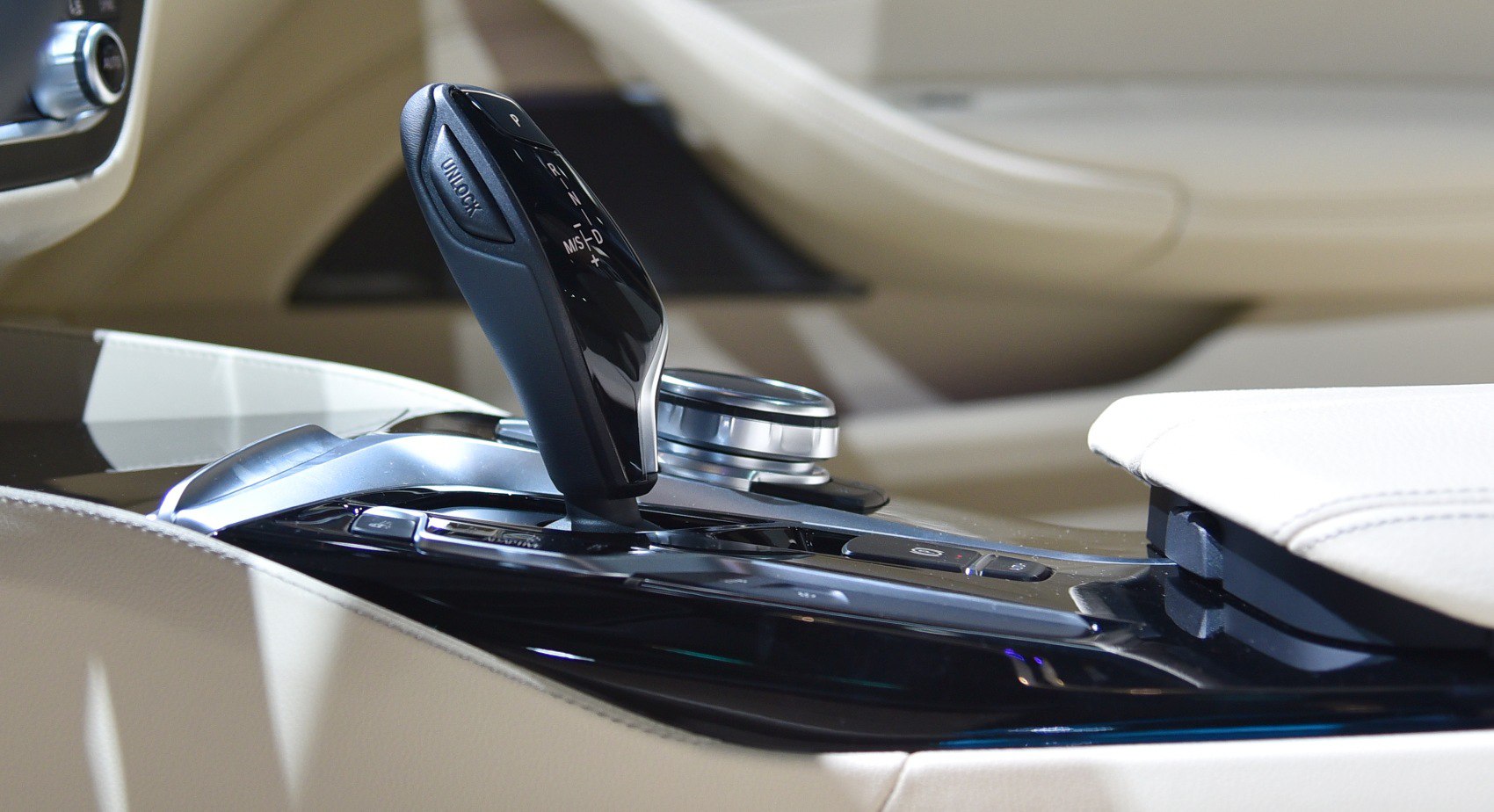 Close-up of gear shift lever and center console controls