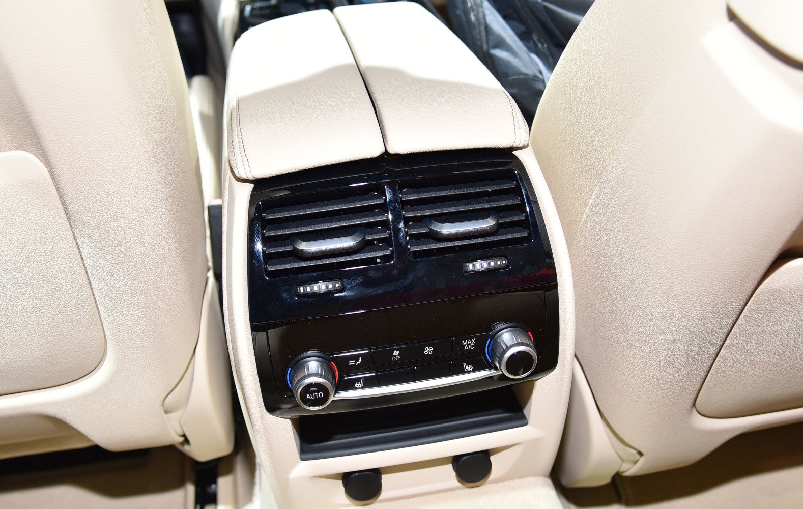 Rear climate control panel with air vents and temperature knobs