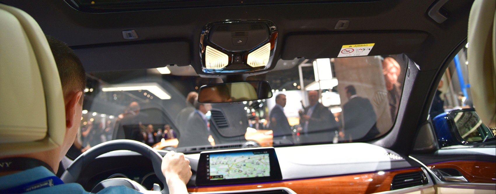 Interior dashboard with digital navigation and wood trim