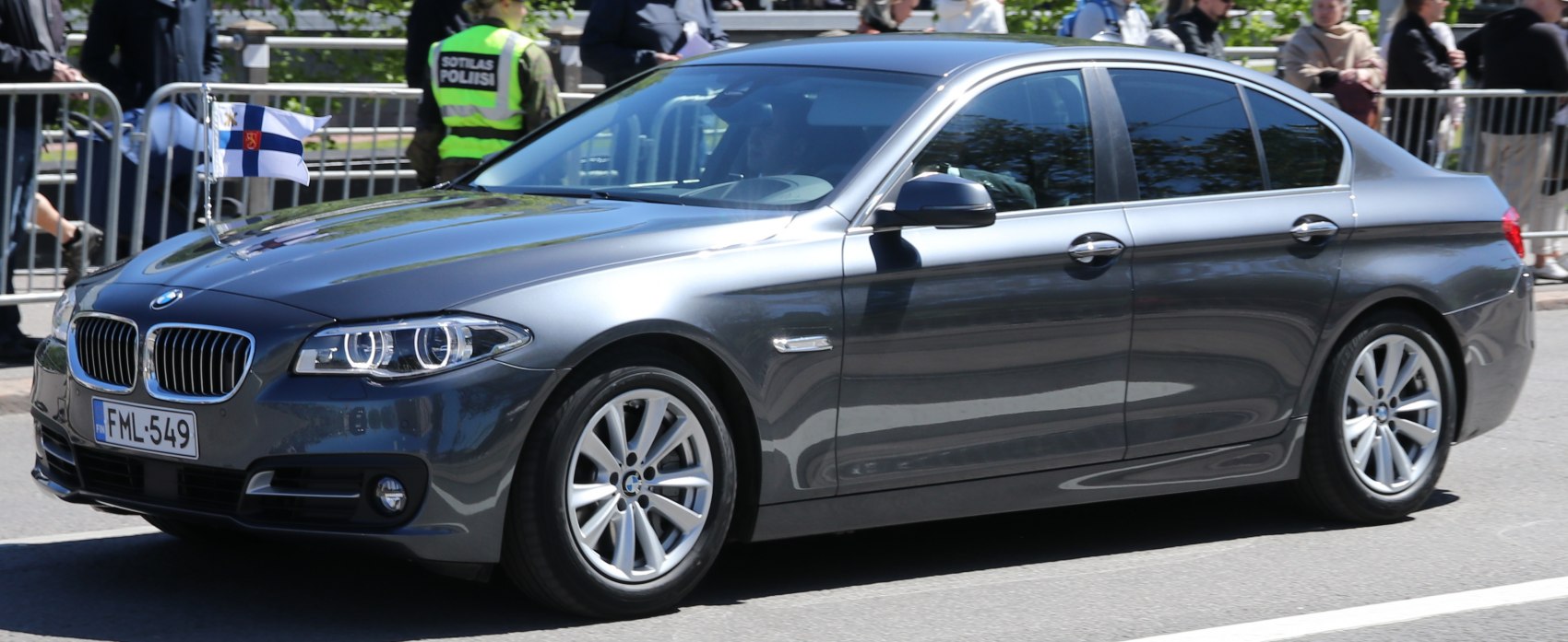 Front and side profile of sedan with updated headlights and alloy wheels