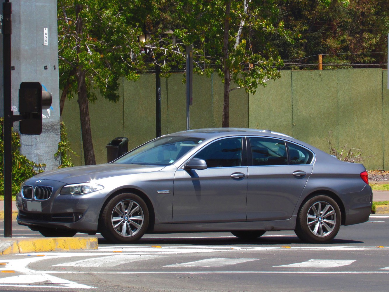 Side profile of luxury sedan with alloy wheels