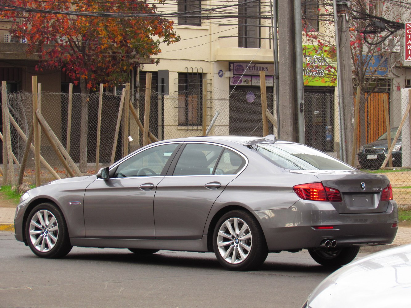 Rear side profile with tail lights and alloy wheels