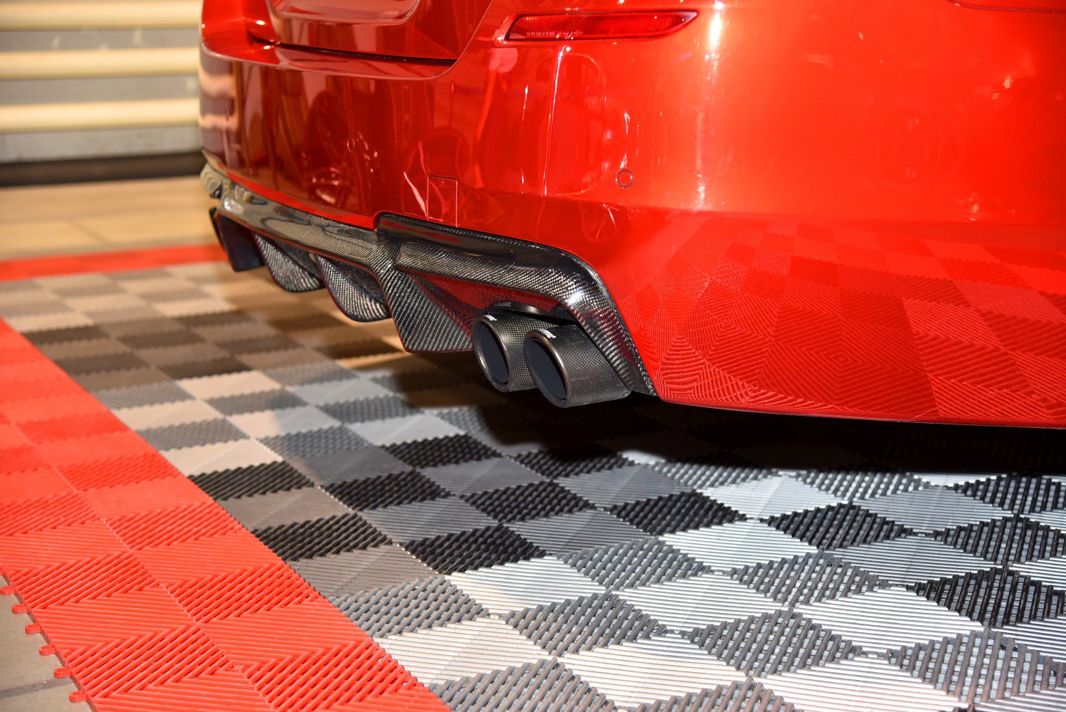 Carbon fiber rear diffuser and dual exhaust tips on rear bumper.