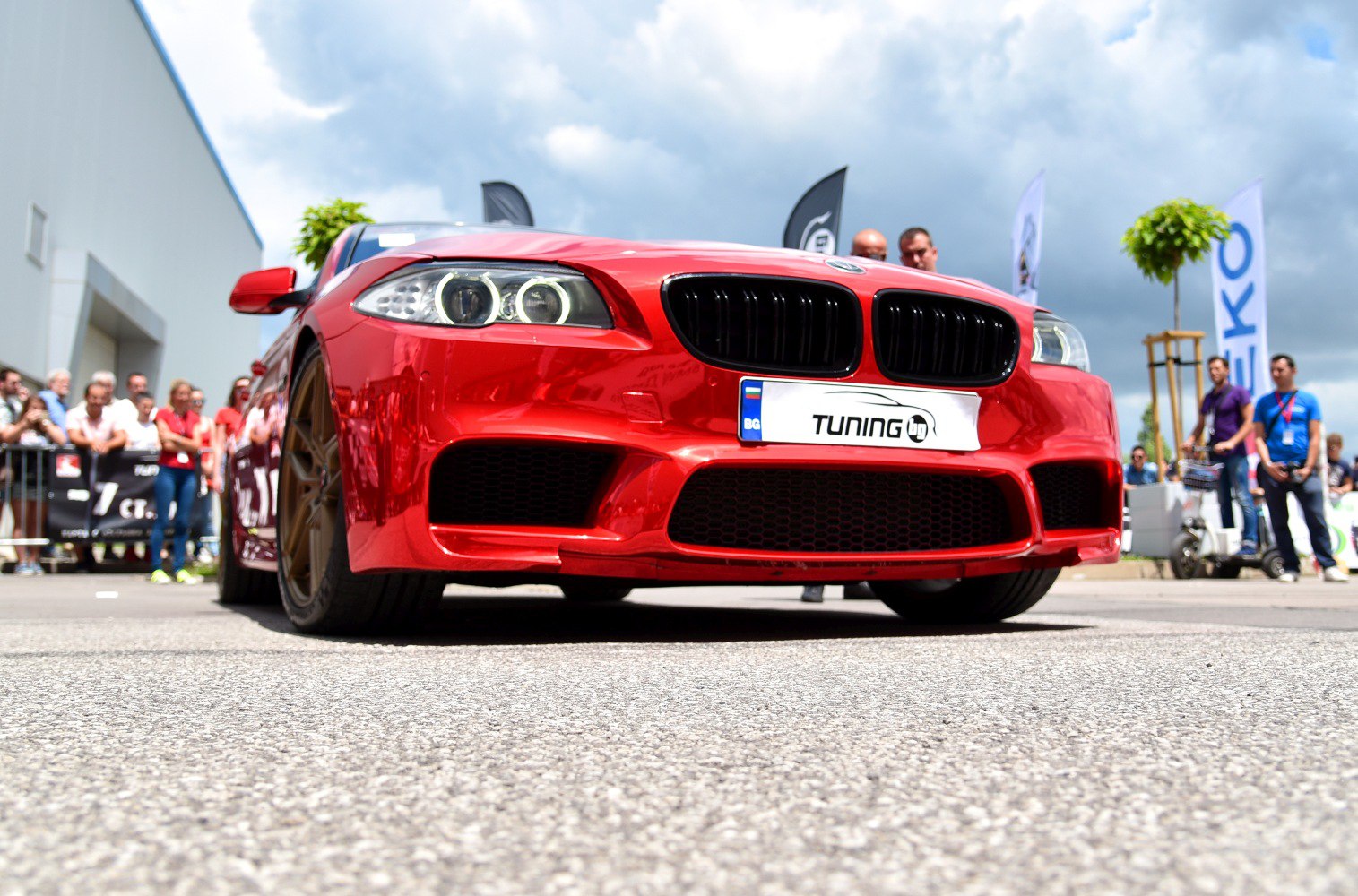 Red front sedan with angel eye headlights and sporty grille