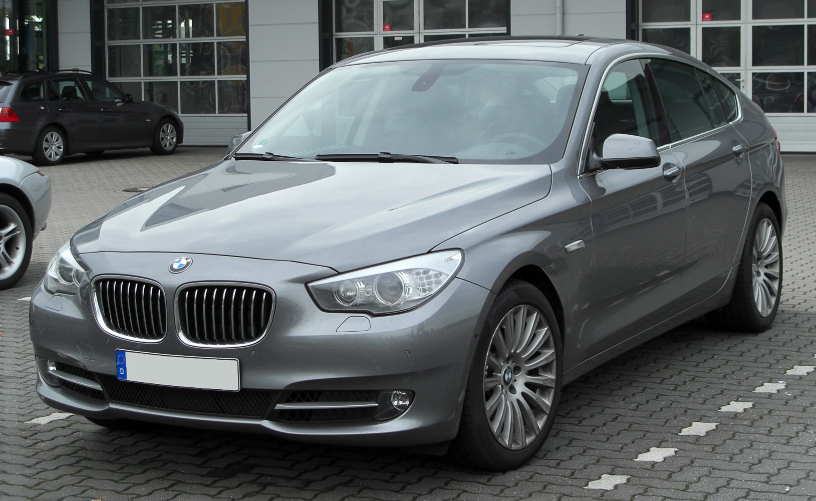 Front three-quarter view showing kidney grille and headlights