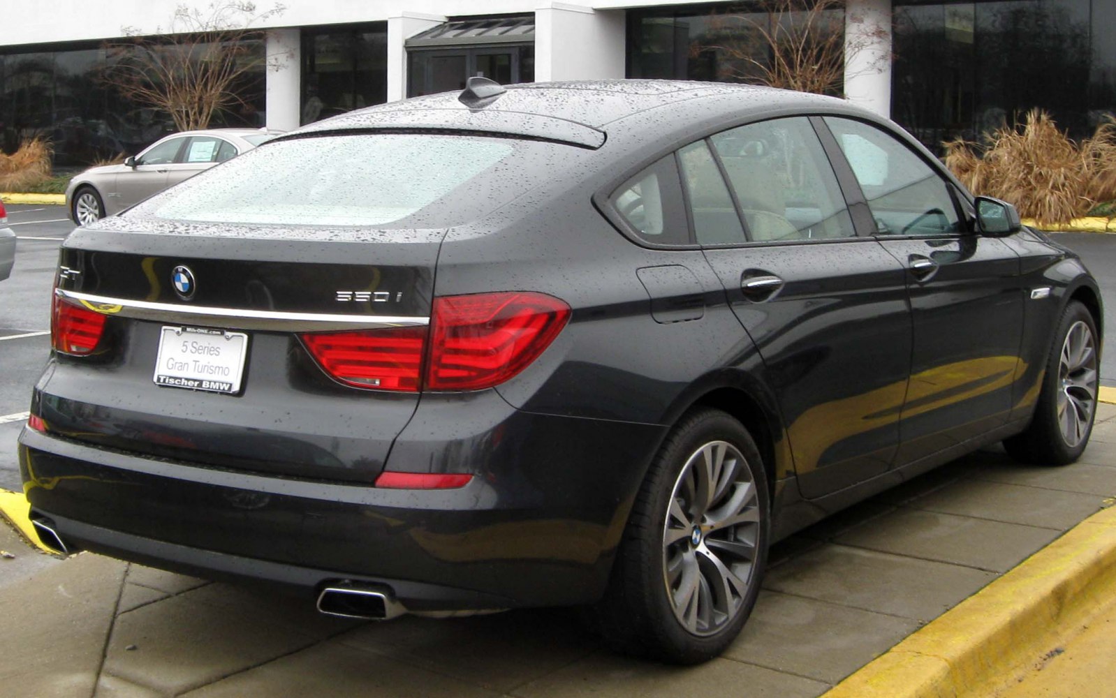 Hatchback rear profile with signature tail lights and dual exhaust
