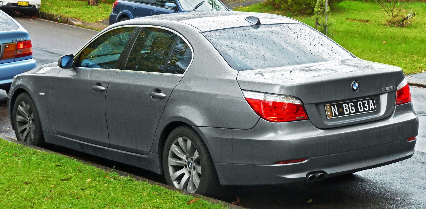 Rear side view with taillights and exhaust pipes