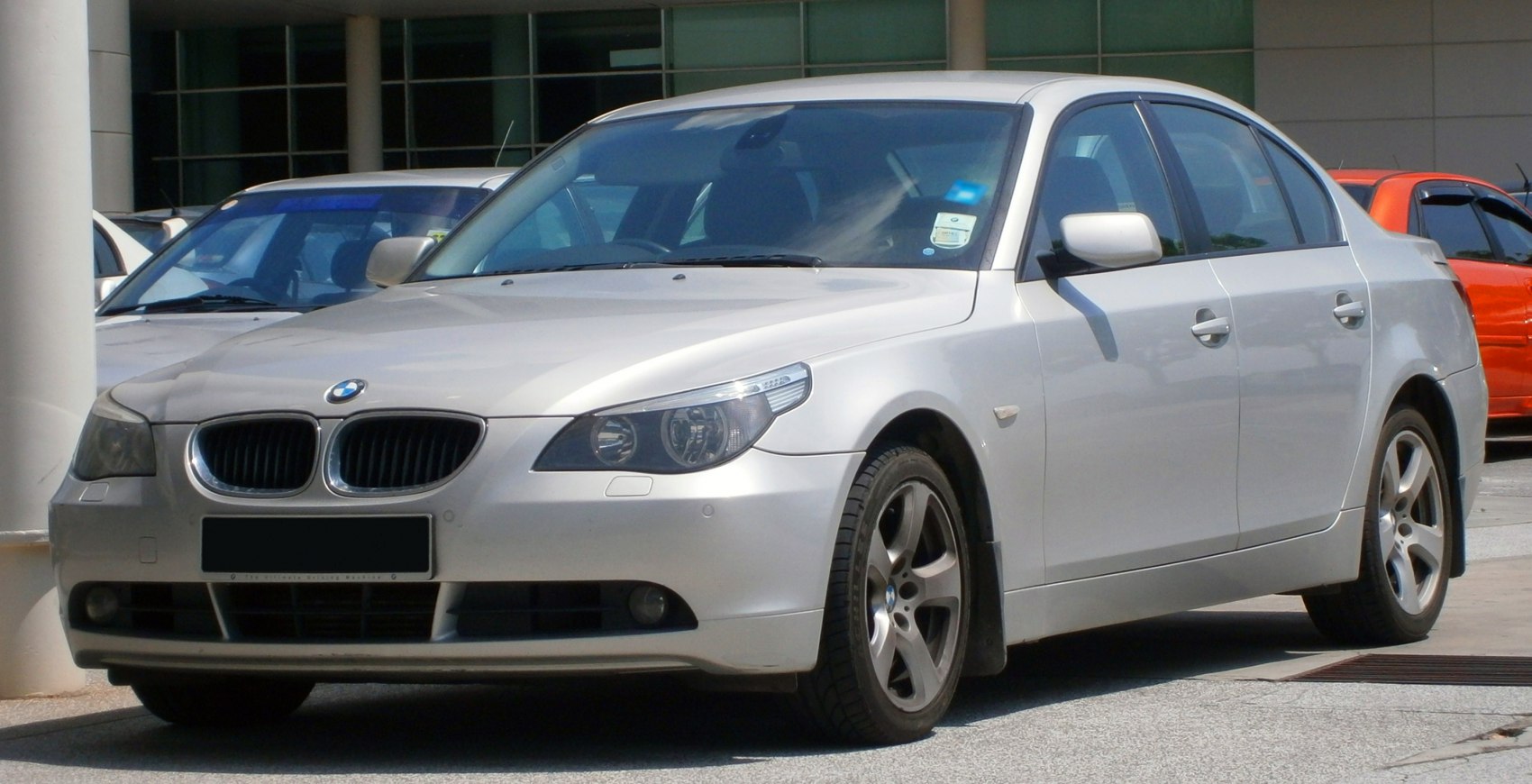 Silver sedan with front side view and alloy wheels