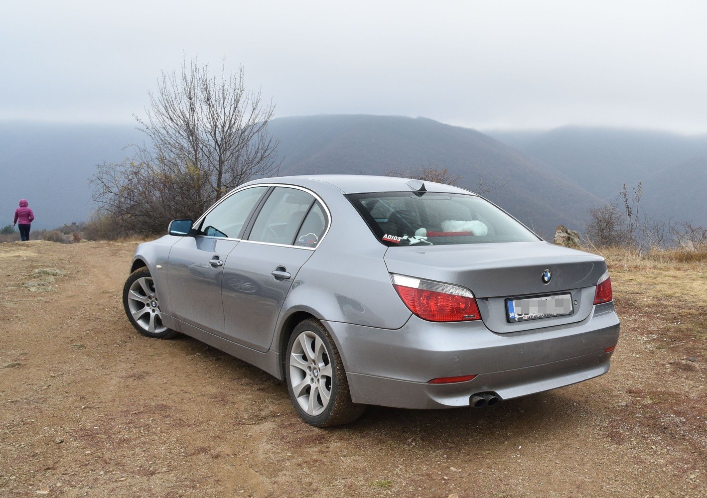 BMW 5 Series E60 rear and side view with dual exhaust and tail lights