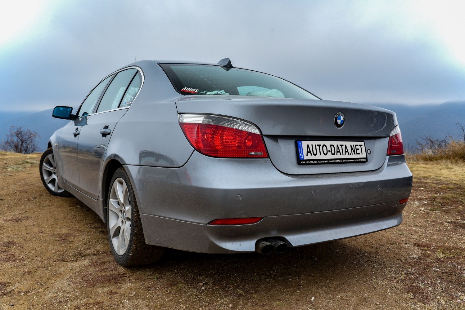 Rear view with distinctive taillights and dual exhaust pipes