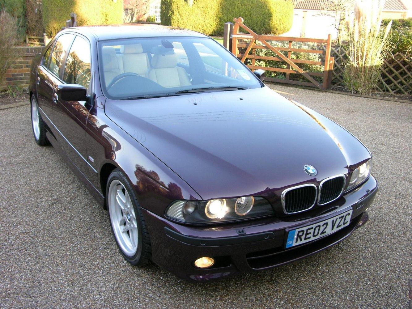 Front angled view of sedan with kidney grille and headlights.