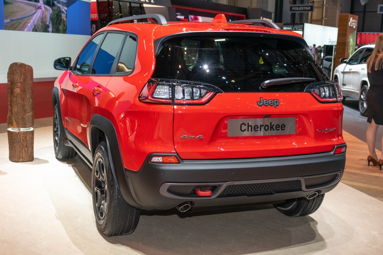 Red SUV rear view with LED taillights, 4x4 badge, and visible tow hook