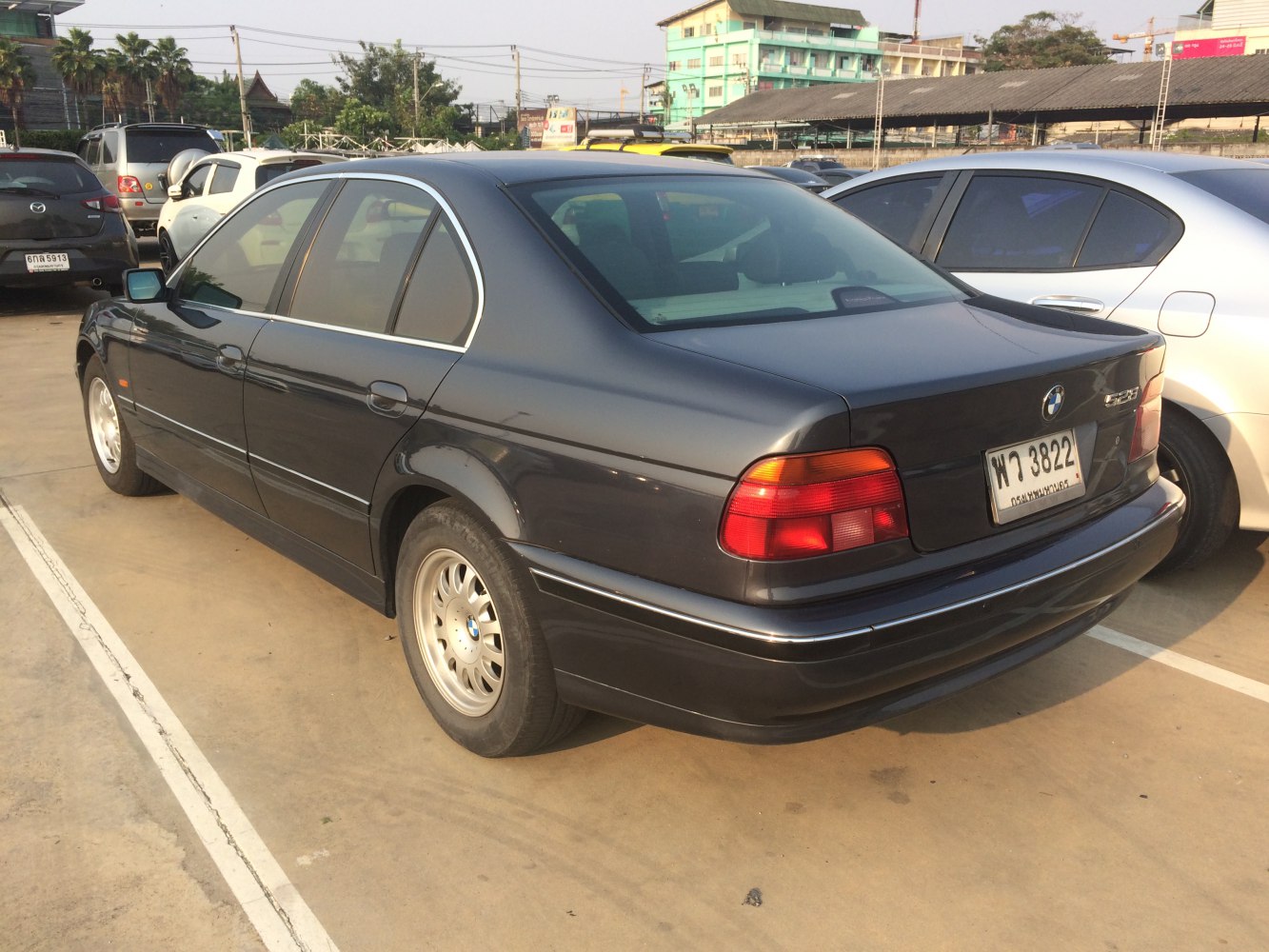 Rear view of classic sedan with distinctive tail lights and rear bumper