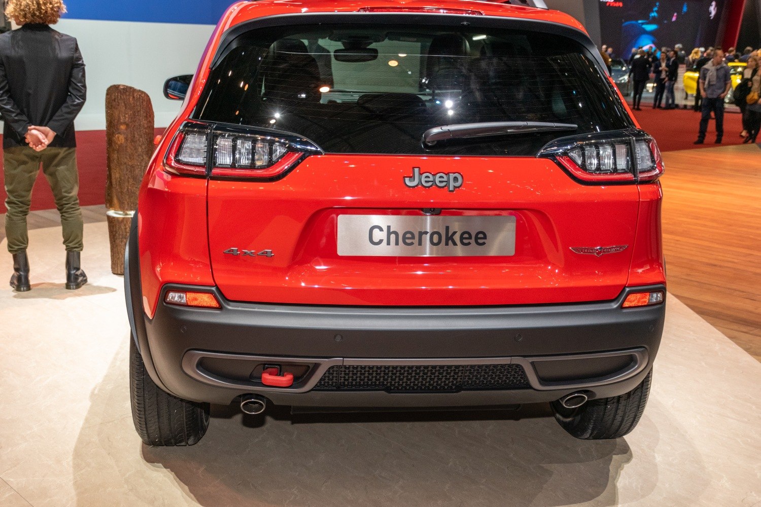 Rear view with tail lights, 4x4 badge, and rugged bumper