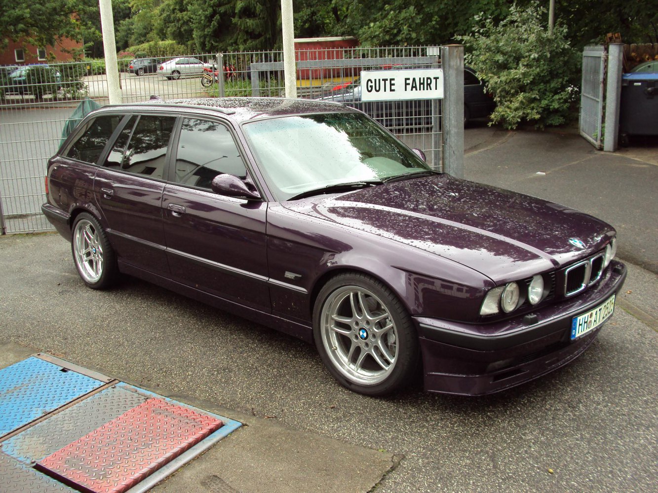 Side view of touring wagon with dual headlights and alloy wheels