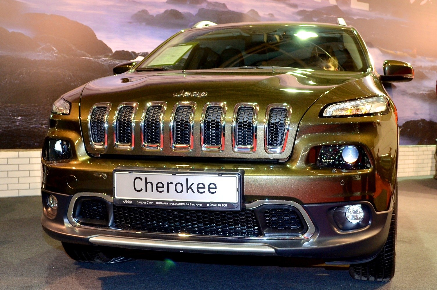 Close-up of Jeep's seven-slot grille and split headlight design.