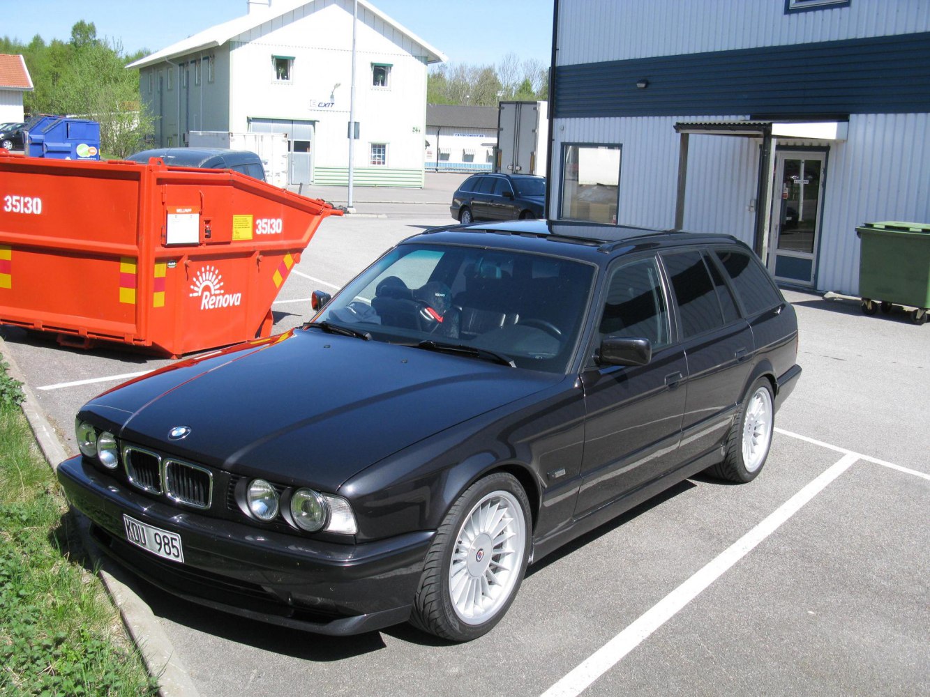 Black station wagon with sunroof and alloy wheels