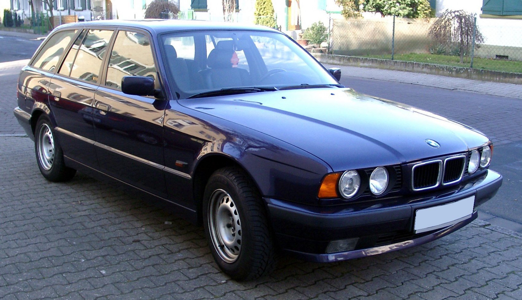 Classic station wagon front-side exterior with distinctive headlights and estate body style