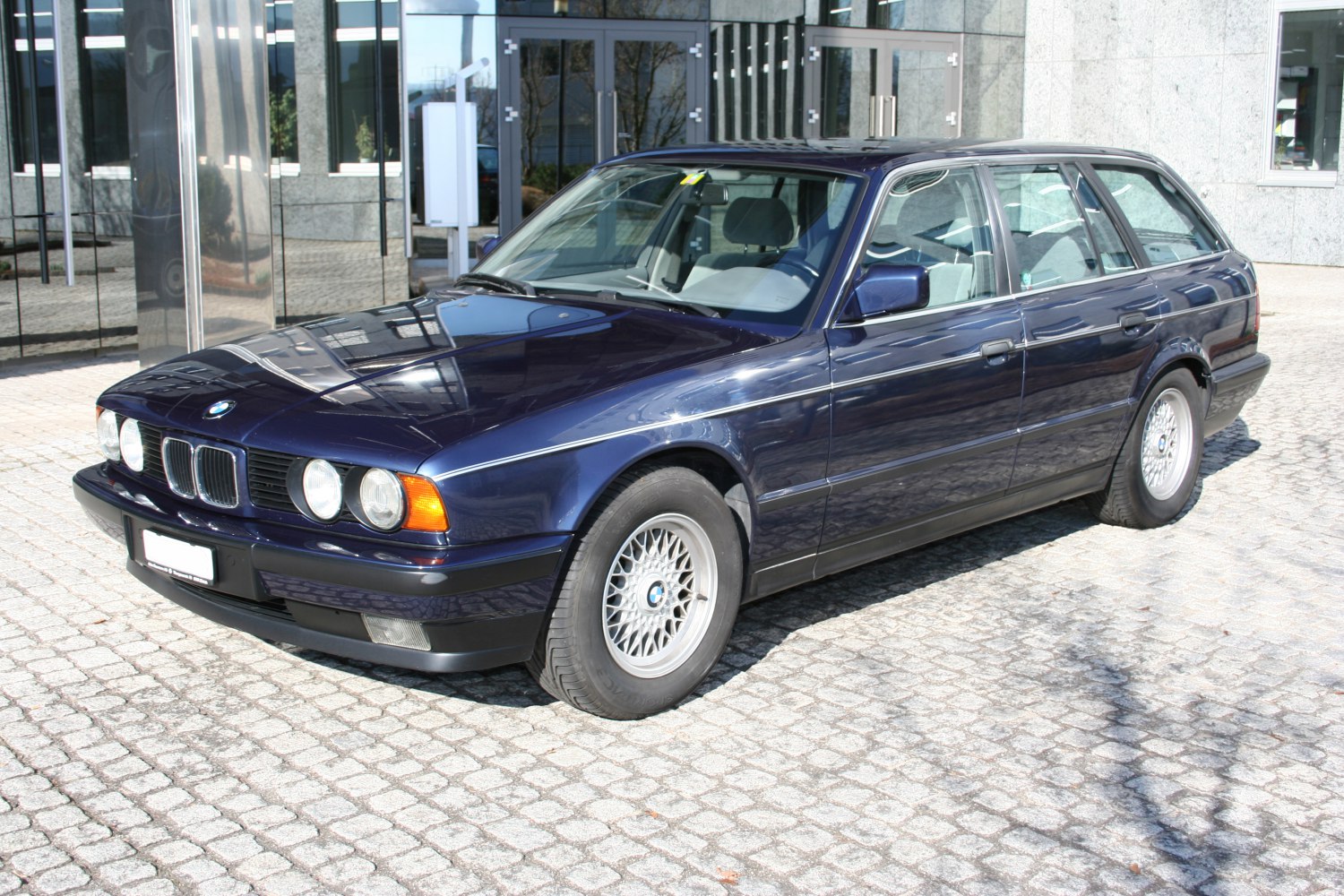 Station wagon with quad round headlights and alloy wheels