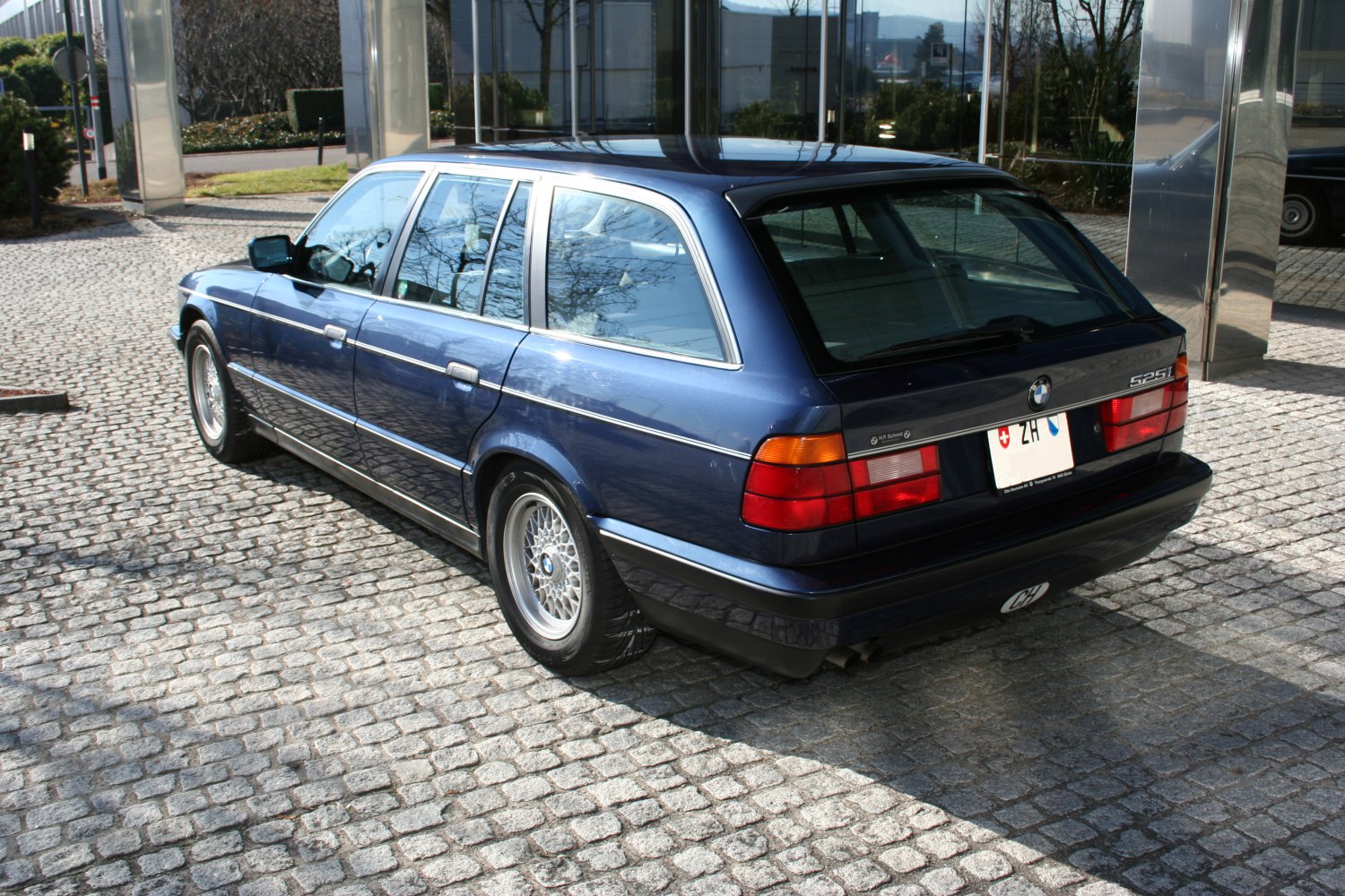 Rear and side view of classic station wagon with alloy wheels