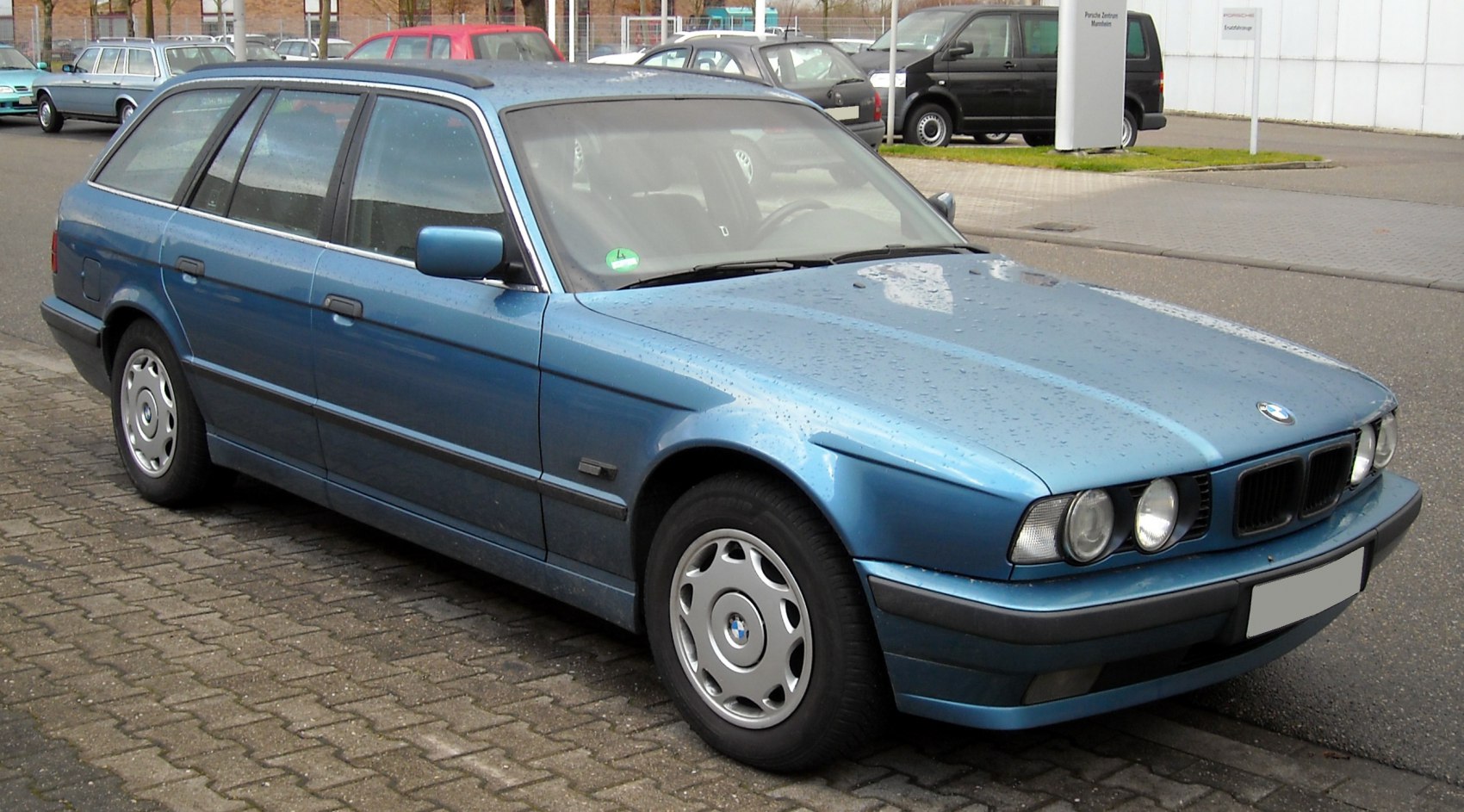 Front and side view of a classic E34 5 Series Touring wagon