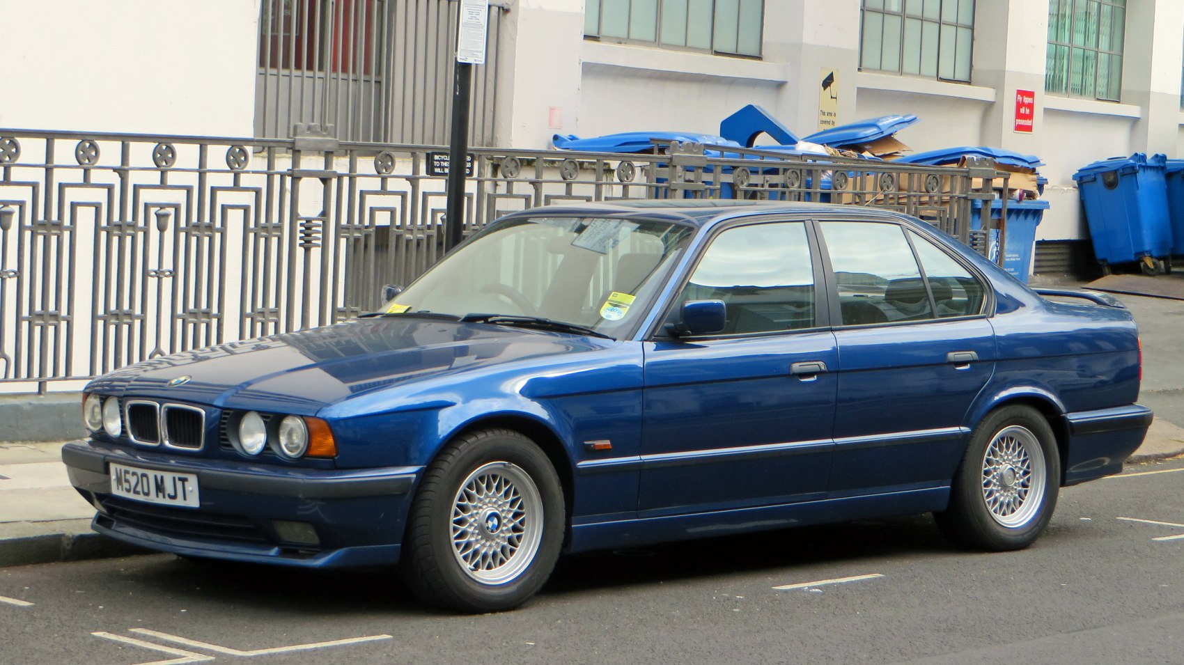 Classic sedan with quad headlights, kidney grille, and alloy wheels
