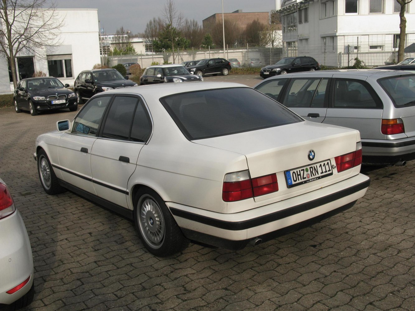 Rear view of a classic 1988 vintage sedan with distinctive taillights and aerodynamic trunk