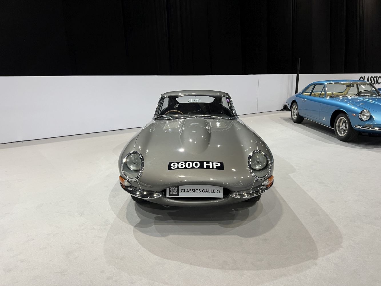Front view of classic 1961 Jaguar E-type with aerodynamic hood and round headlights