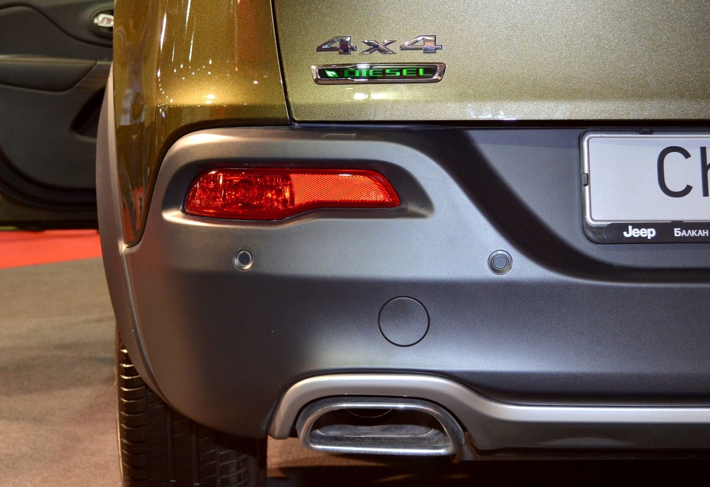 Rear bumper with 4x4 diesel badge and exhaust pipe close-up