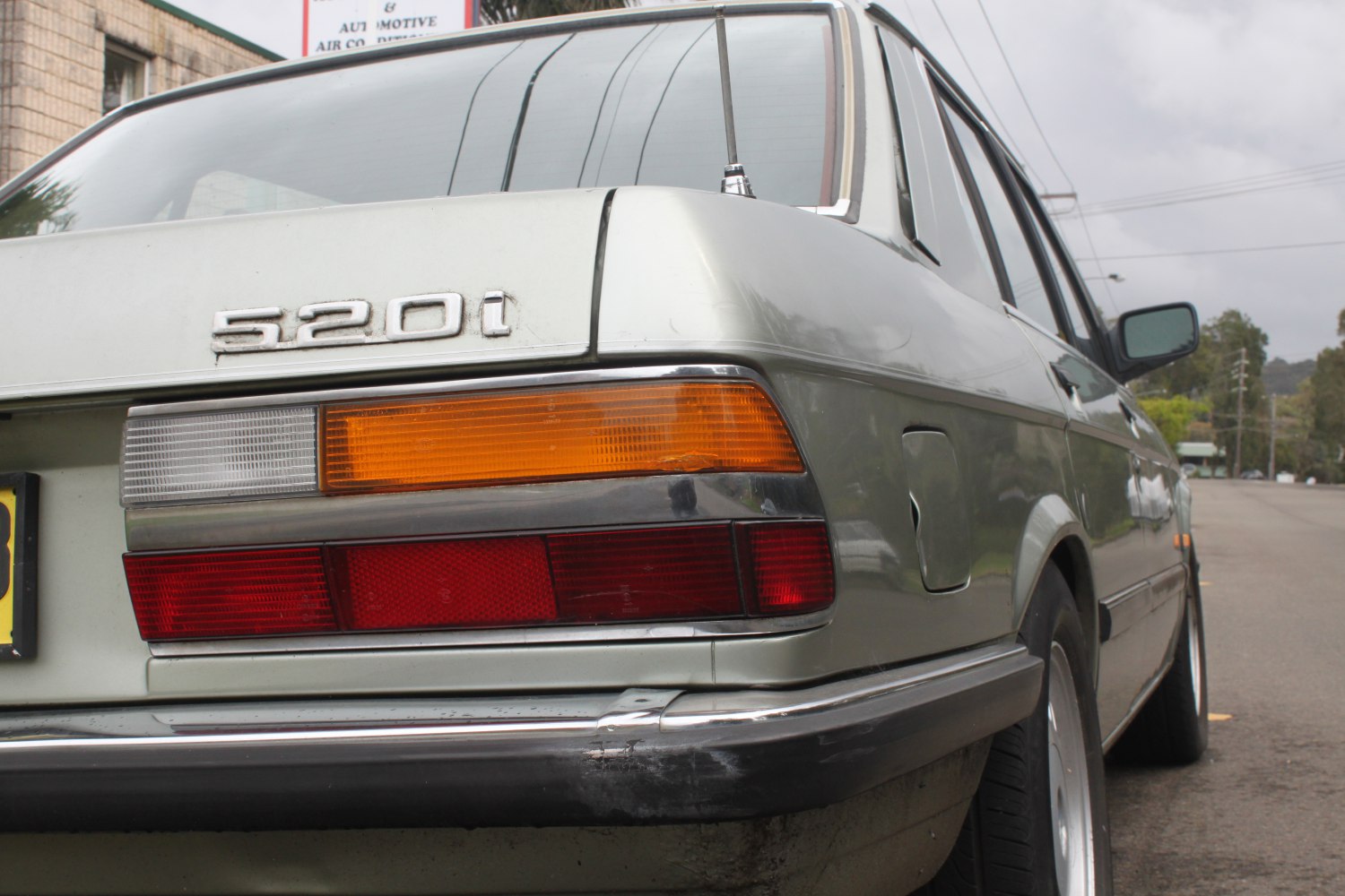 Classic BMW rear with 520i badge and distinctive tail lights