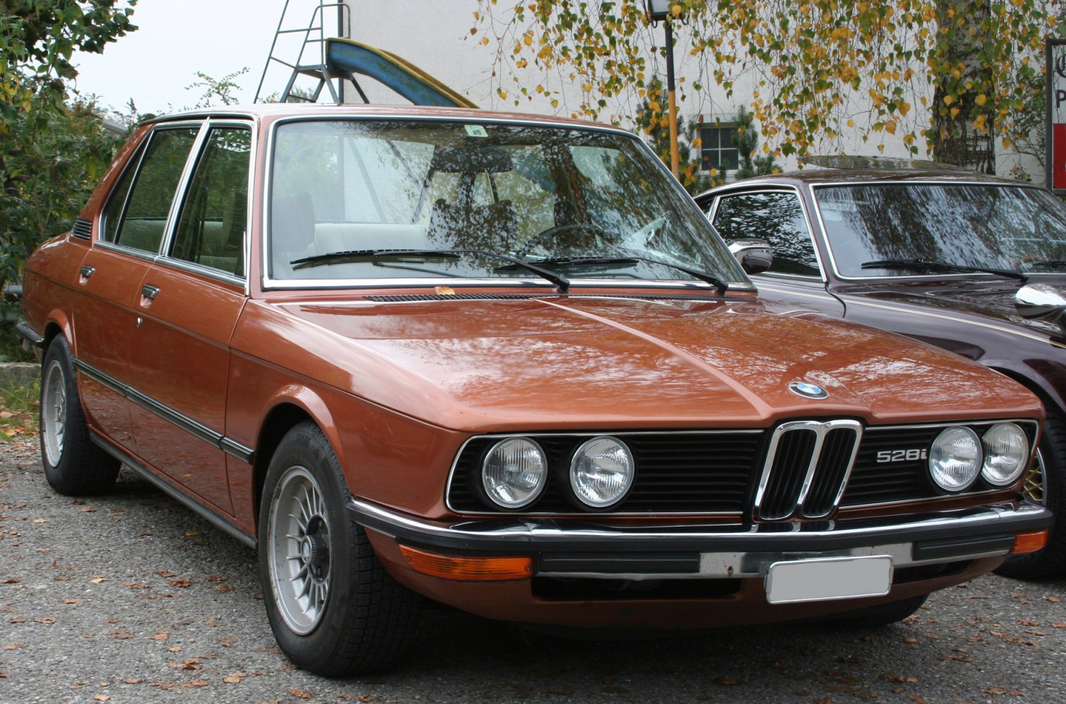 Vintage sedan front with quad round headlights and kidney grille
