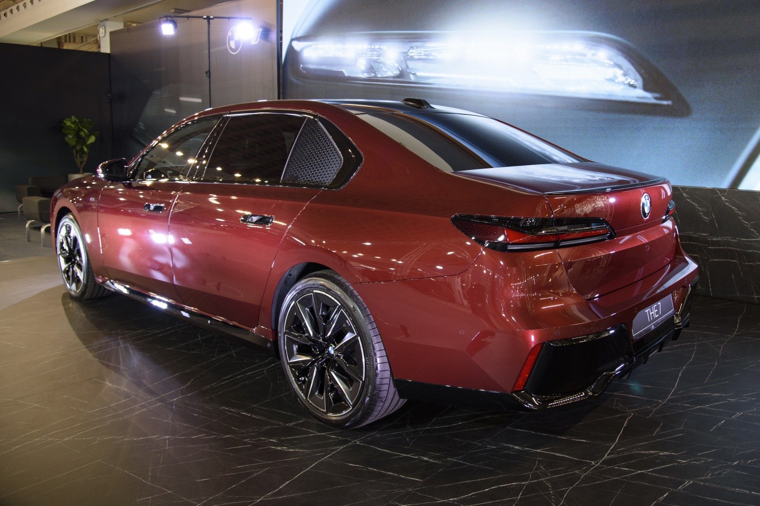 Sleek rear and side view of luxury sedan with modern tail lights and alloy wheels