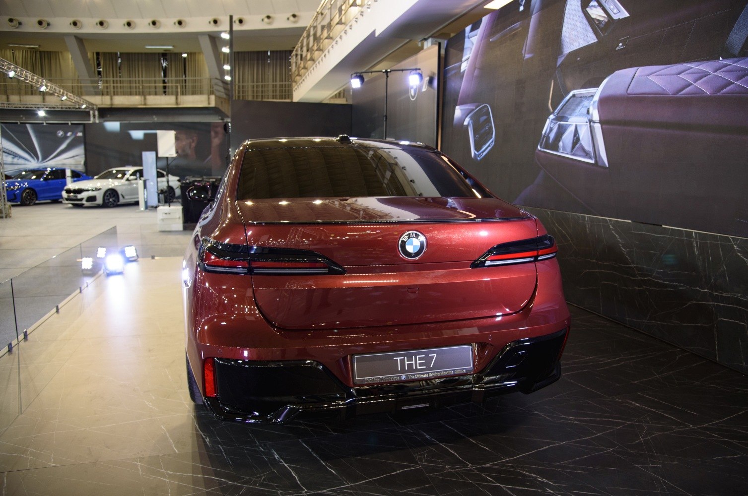 Sleek LED tail lights and elegant rear design of a luxury sedan.